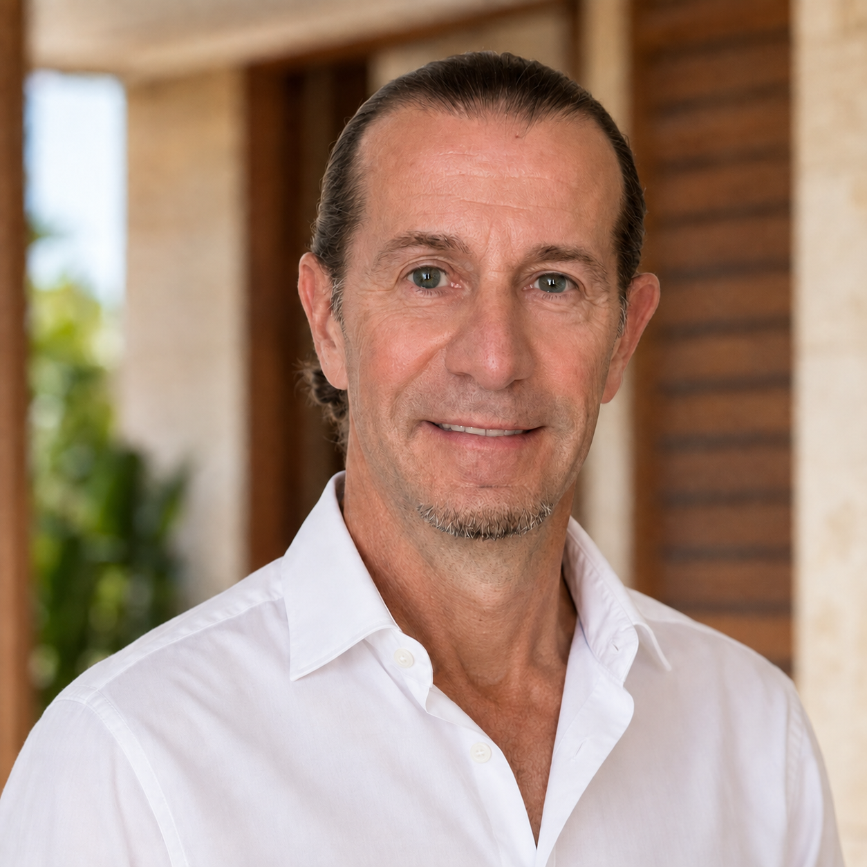 Portrait of Jean-Marie Riou, Pérez Real Estate agent, wearing a white shirt